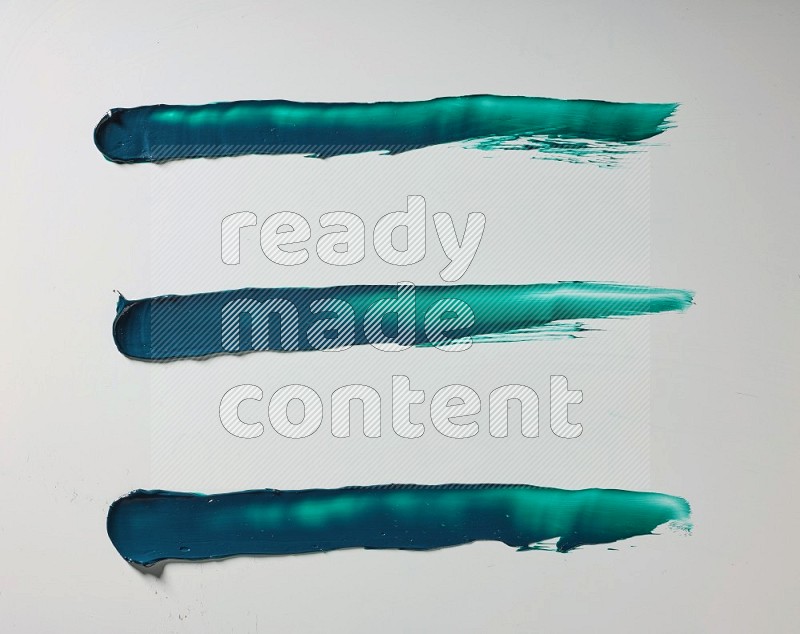 Turquoise painting knife strokes on white background