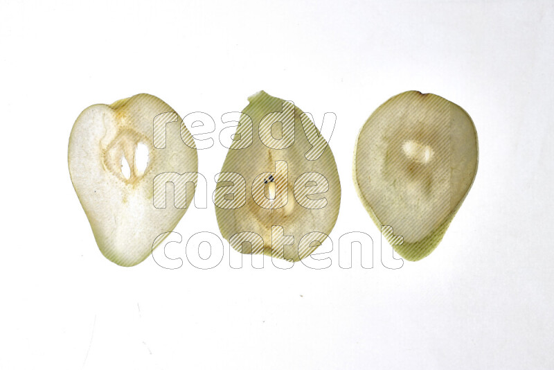 Pear slices on illuminated white background