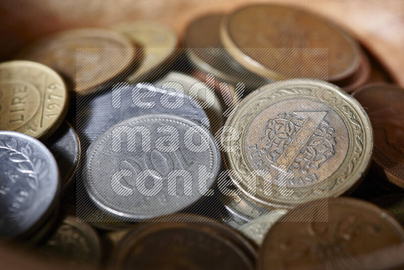 A close-ups of random old coins on black background