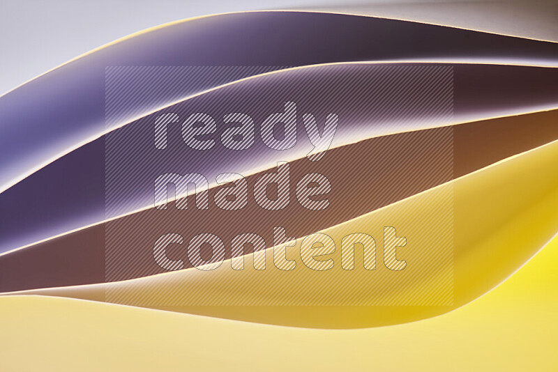 This image showcases an abstract paper art composition with paper curves in purple and gold gradients created by colored light