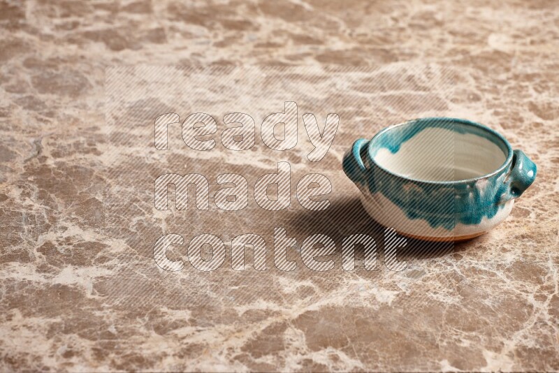Multicolored Pottery Bowl on Beige Marble Flooring