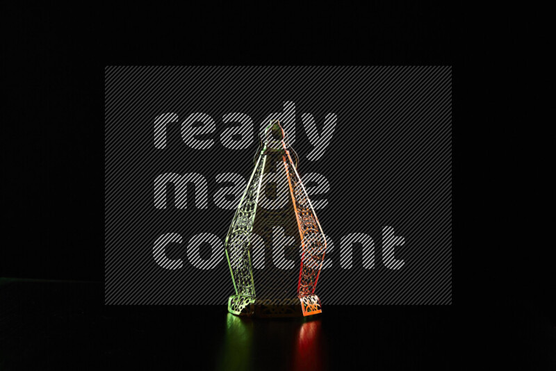 Ramadan lanterns with colored rim light against black background