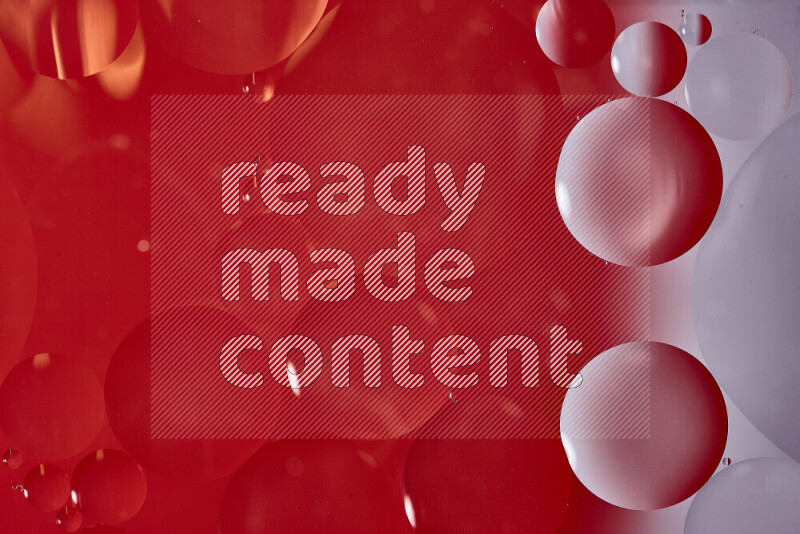 لقطات مقربة لفقاعات من الزيت على سطح الماء باللون الأبيض والأحمر