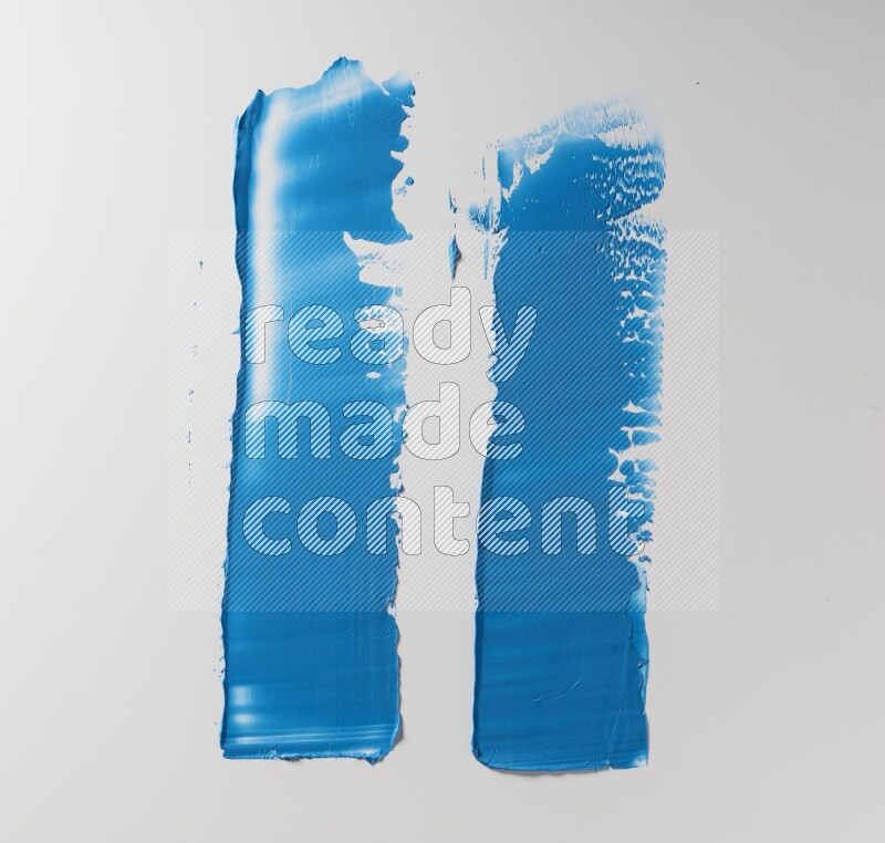 Blue painting knife strokes on white background