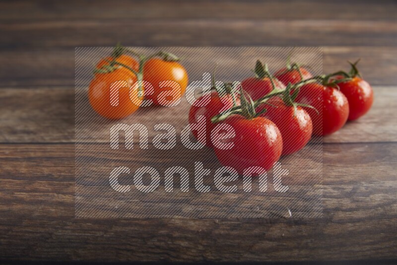 Mixed cherry tomato veins on a textured wooden background 45 degree