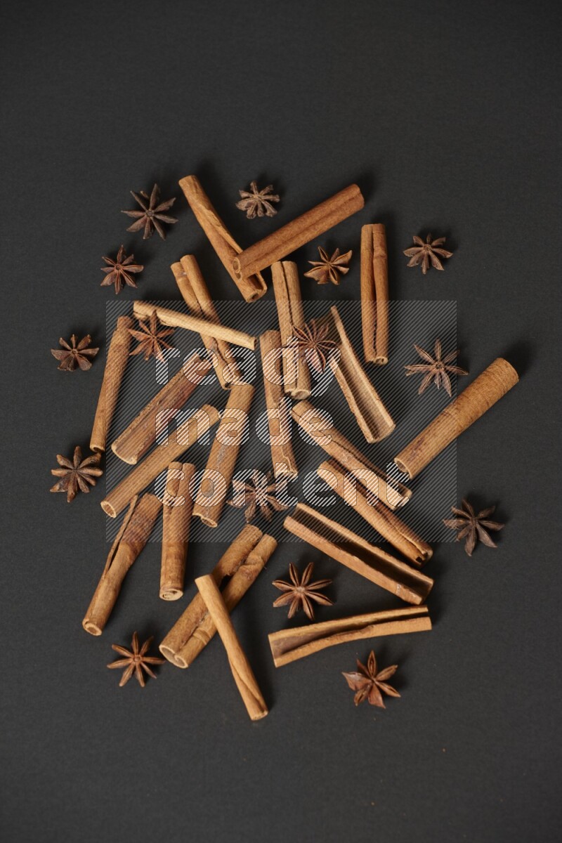 Cinnamon sticks and star anise on black background
