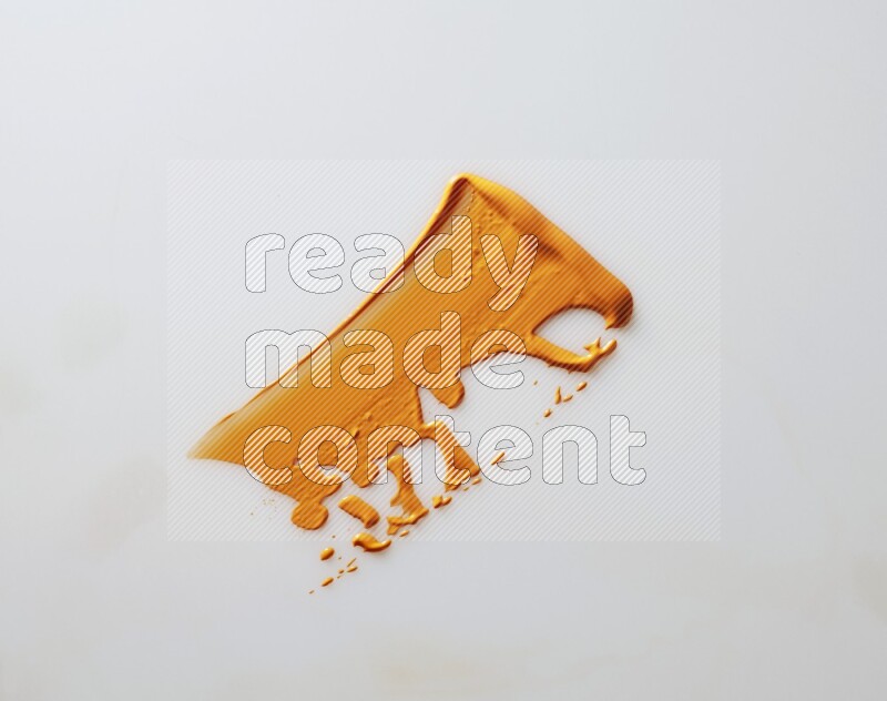 An orange single curved painting knife stroke on white background