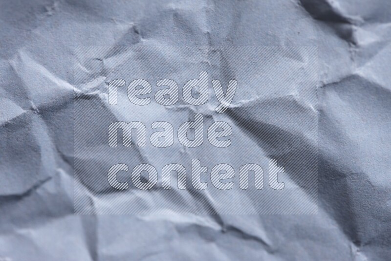 Crumpled craft paper on black background
