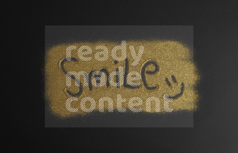 A word written with gold glitter on black background