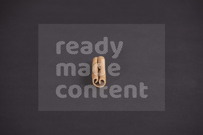 Cinnamon stick on black background