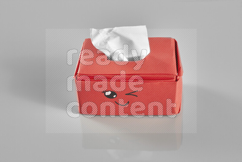 Origami tissue box on grey background