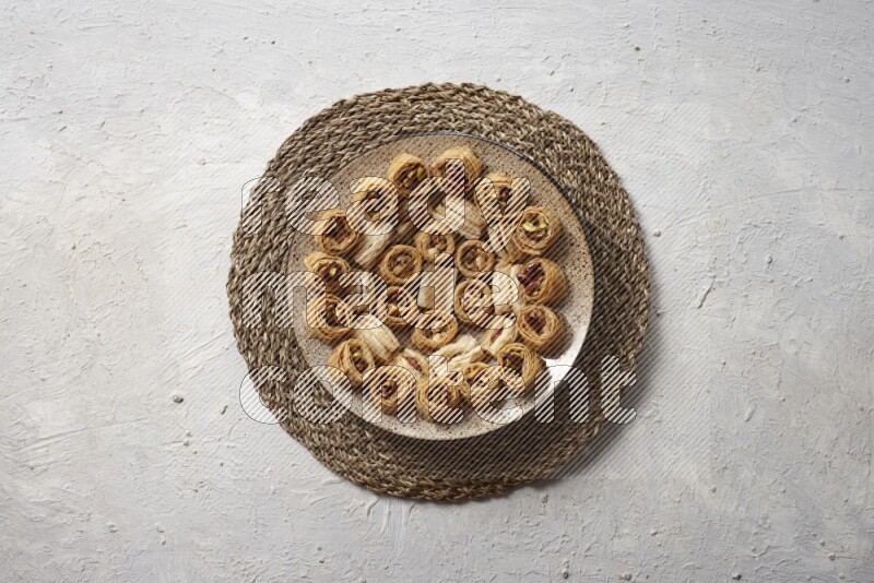 Oriental sweets in pottery plates in a light setup