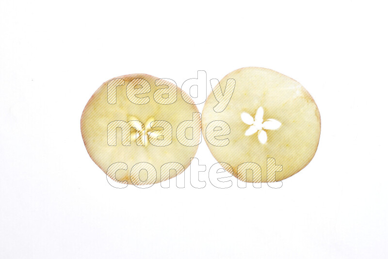 Apple slices on illuminated white background