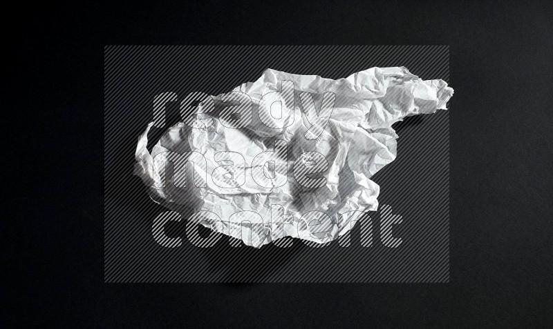 White paper sheet on black background