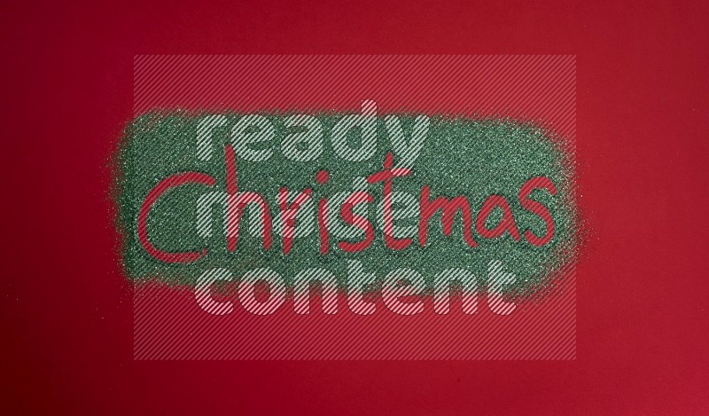 A word written with green glitter on red background