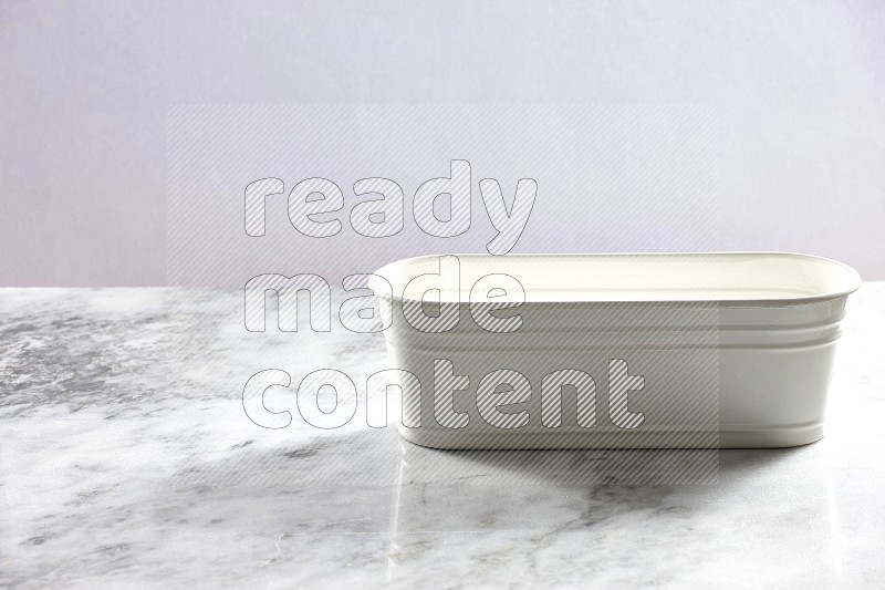 An Empty White Plant Pot on light grey Marble Flooring 45 degree angle