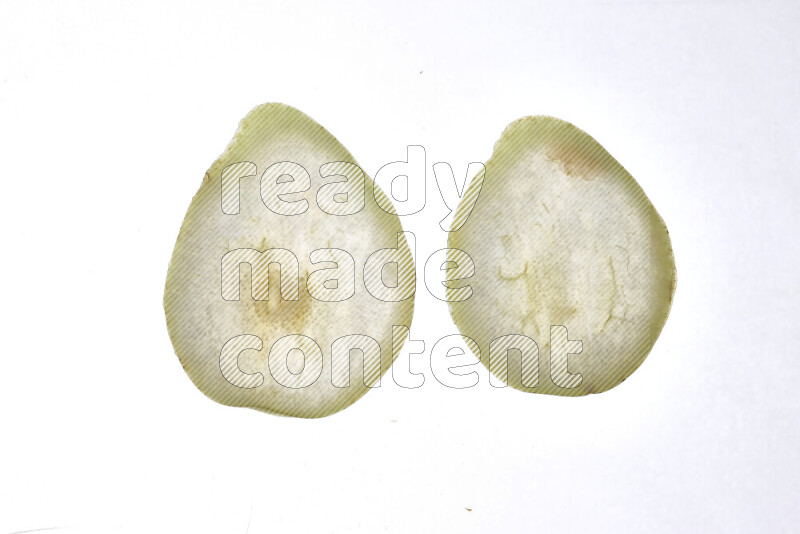 Pear slices on illuminated white background