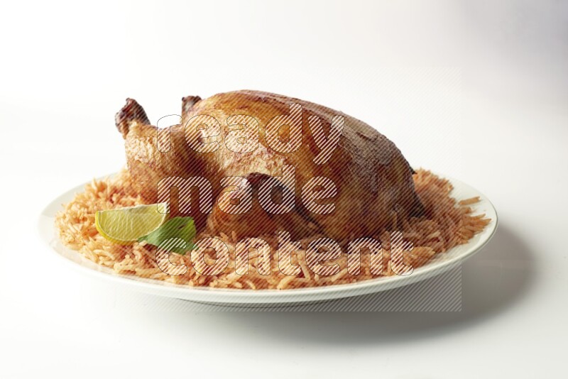 red basmati Rice with  whole roasted chicken on a white rounded plate  direct  on white background