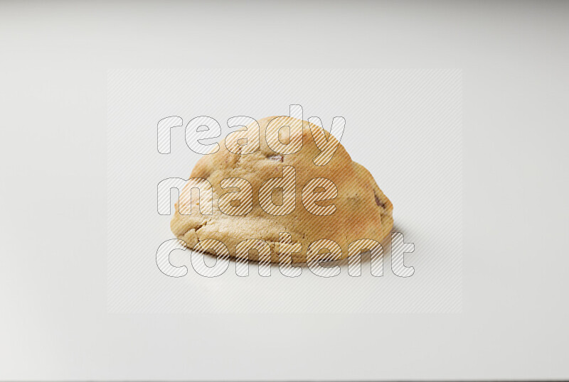 a chocolate chip cookie on a white background