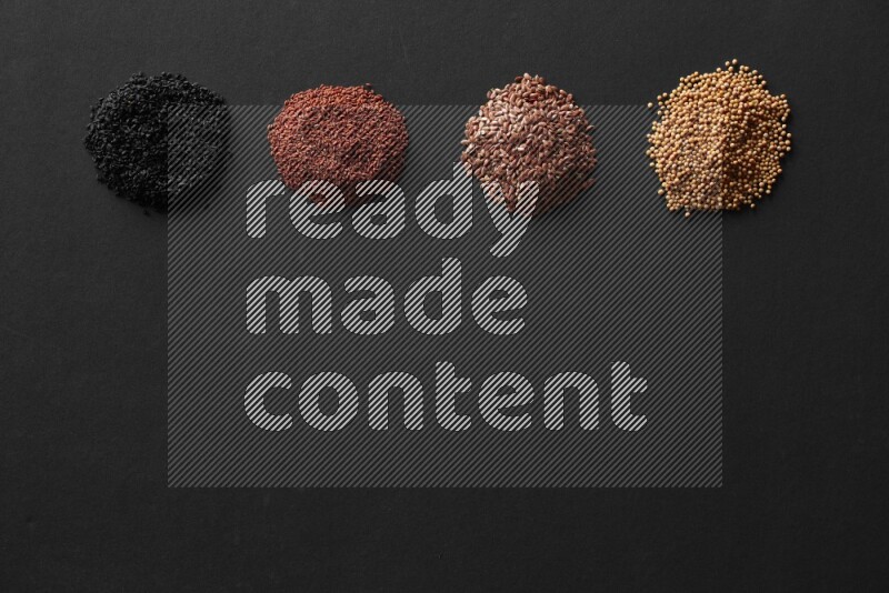 حبة البركة و حبوب الخردل وحبوب الكتان وحب الرشاد علي خلفية سوداء