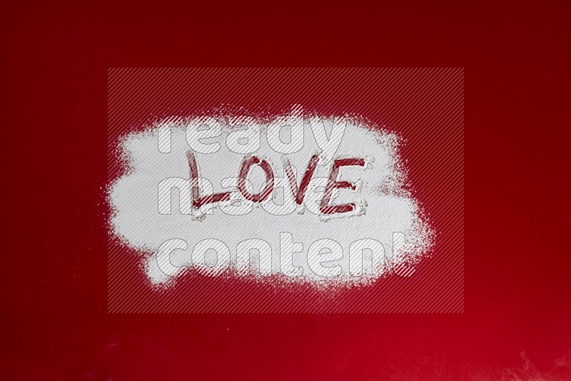 A word written with powder on red background