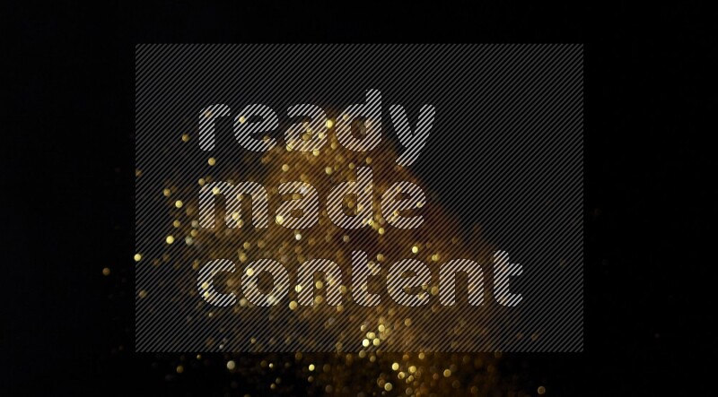 Gold glitter powder isolated on black background