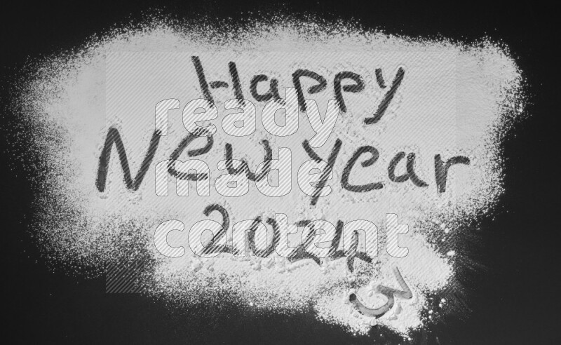 A sentence written with powder on black background