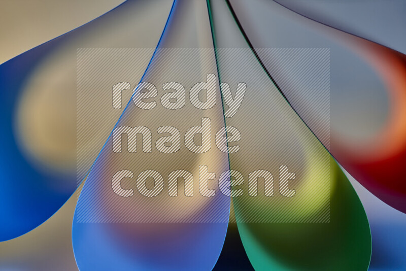 An abstract art piece displaying smooth curves in colorful gradients created by colored light