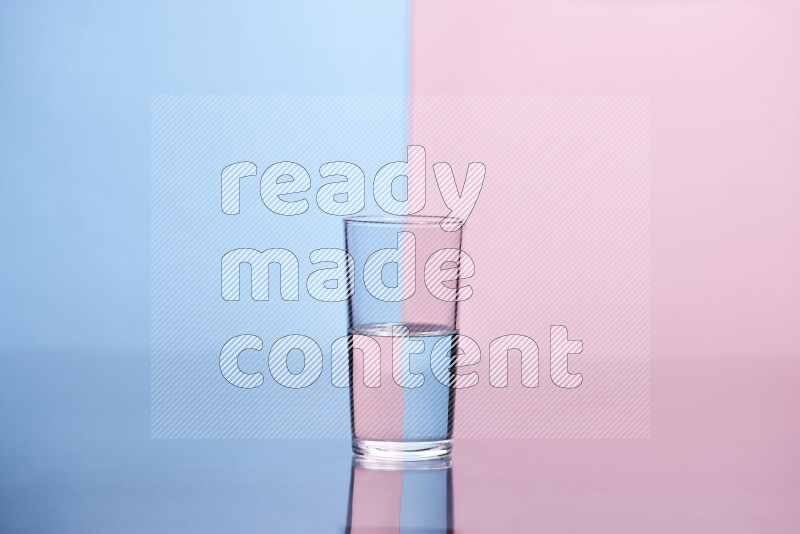 The image features a clear glassware filled with water, set against light blue and rose background