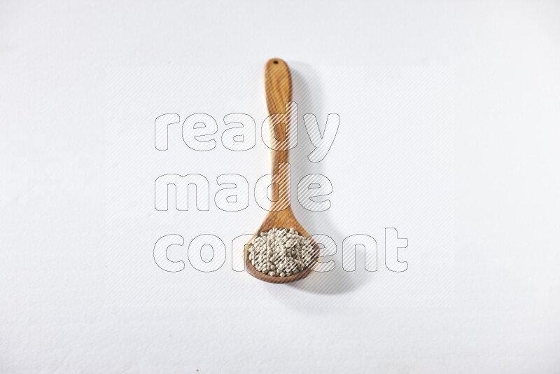 White pepper in a ladle