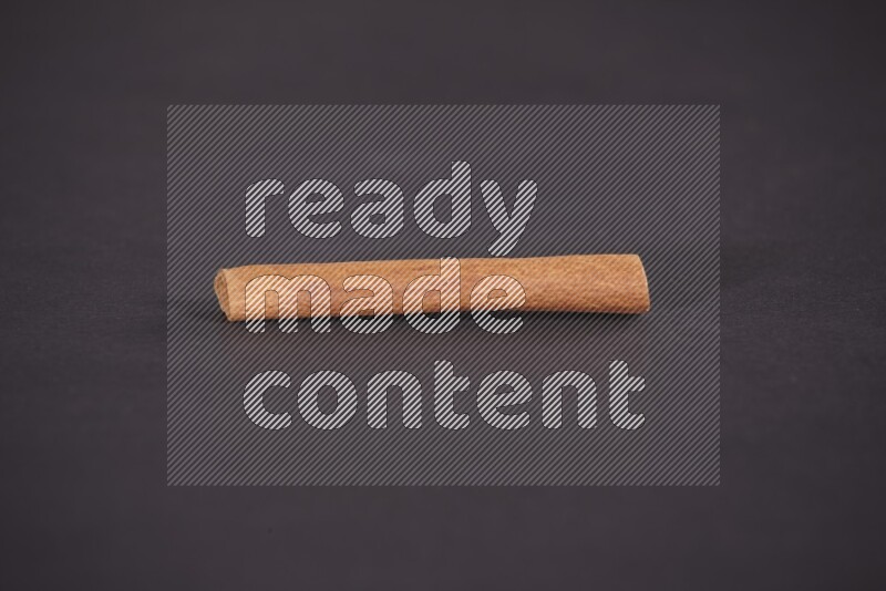 Cinnamon stick on black background