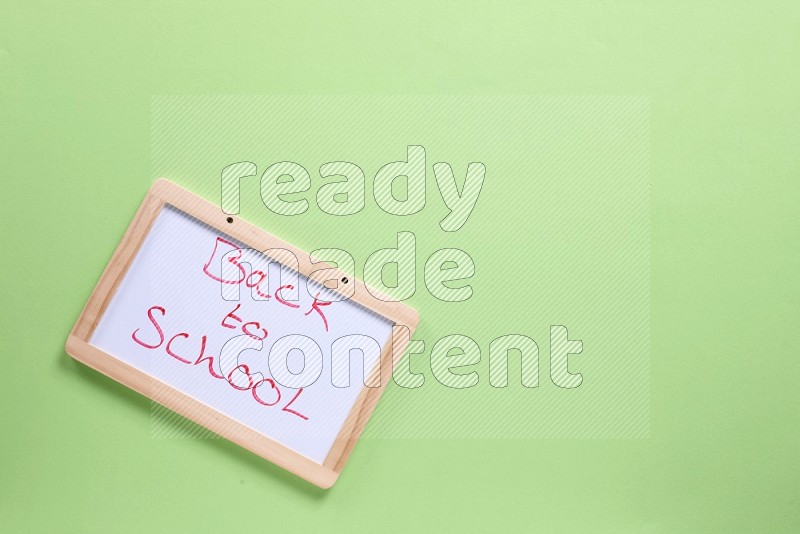 A whiteboard on green background (back to school)