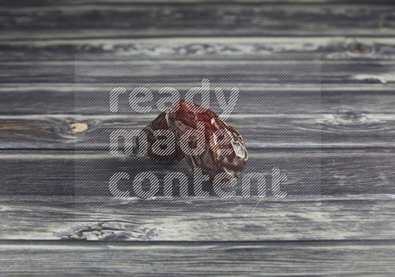two madjoul dates on a wooden grey background