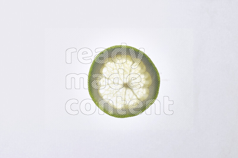 Orange slices on illuminated white background