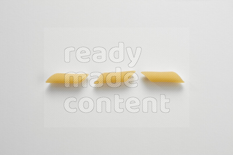 Penne pasta on white background