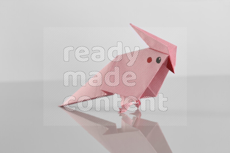 Origami animals on grey background