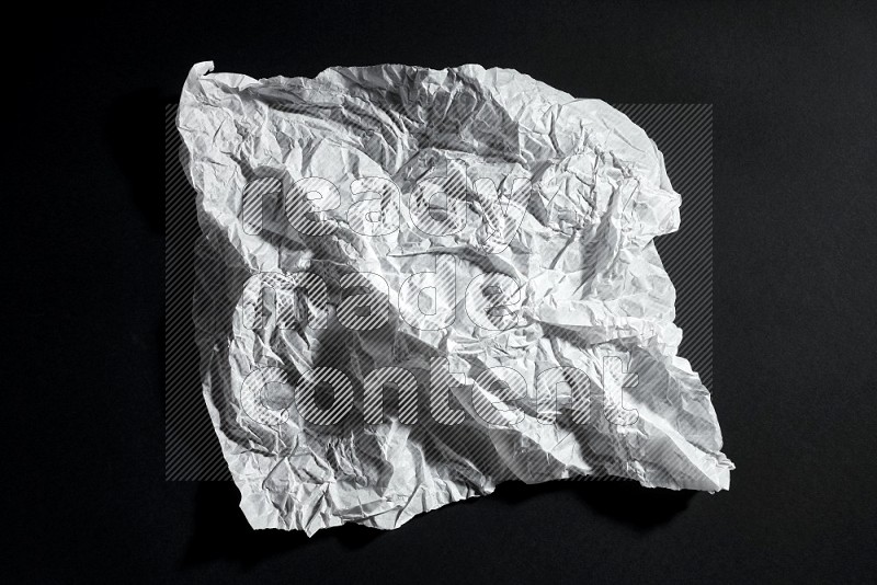 White paper sheet on black background