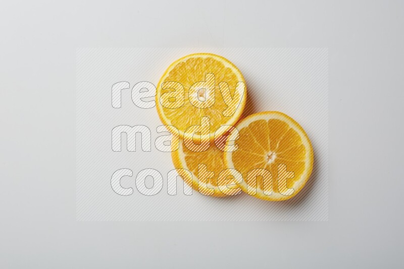 Three orange slices on a white background