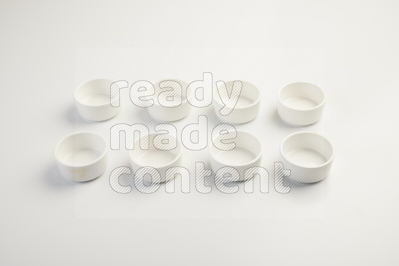 white ceramic round sauce dish on white countertop