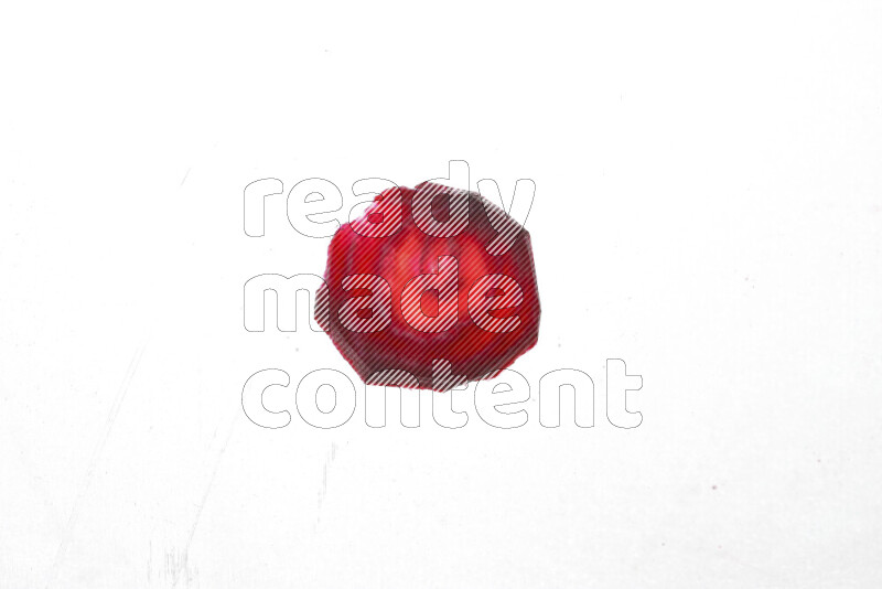 Beet slices on illuminated white background