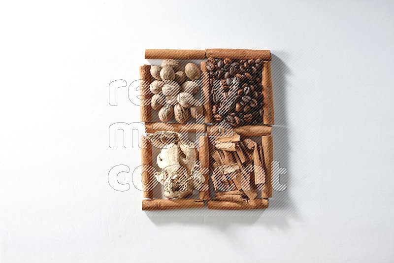 4 squares of cinnamon sticks full of coffee beans, nutmeg, cinnamon and dried ginger on white flooring