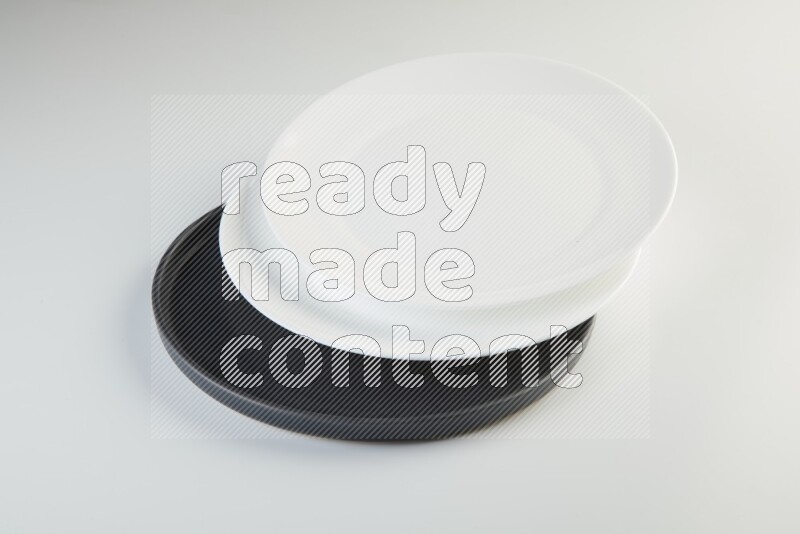 white and black plates on white background