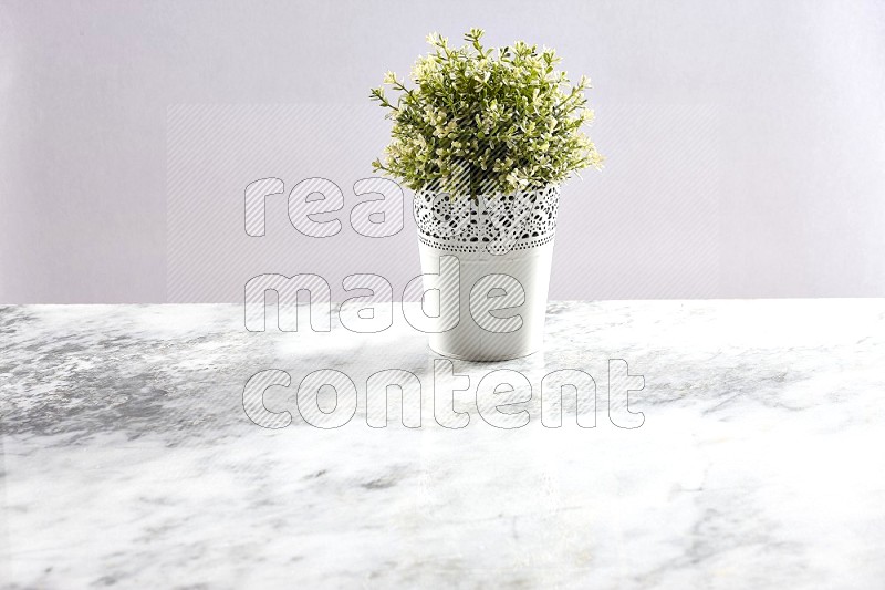 Artificial Thyme Plant in White Decorative Pot on Light Grey Marble Background 45 degree angle