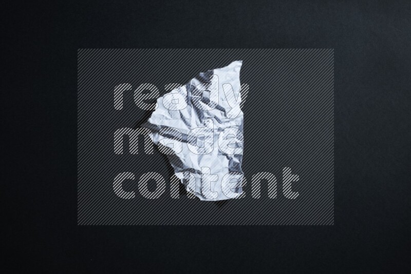 White paper sheet on black background