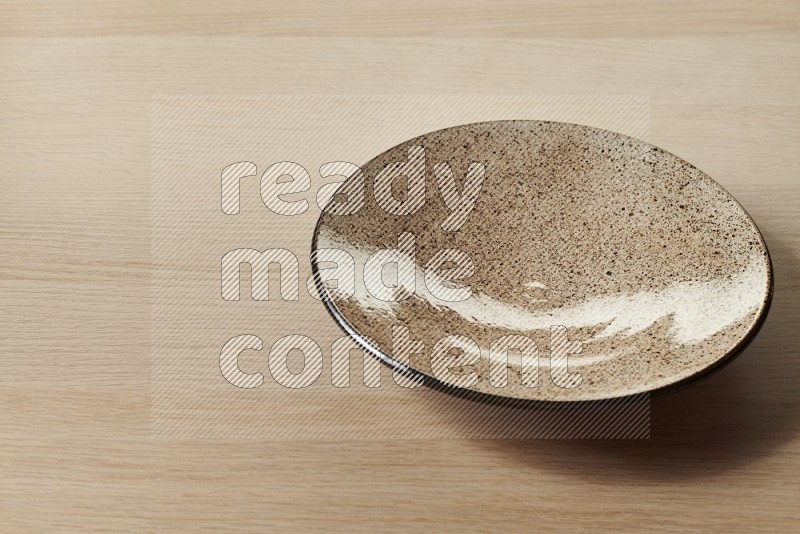 Beige Pottery Plate on Oak Wooden Flooring, 45 degrees