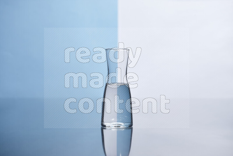 The image features a clear glassware filled with water, set against white and light blue background