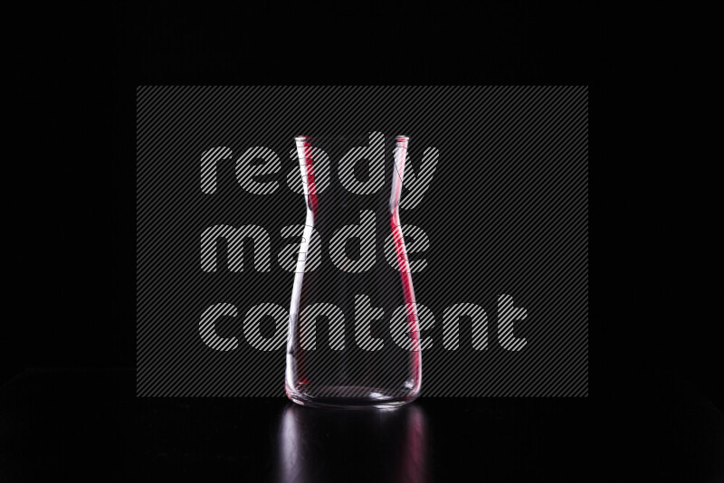 Glassware with rim light in red and white against black background