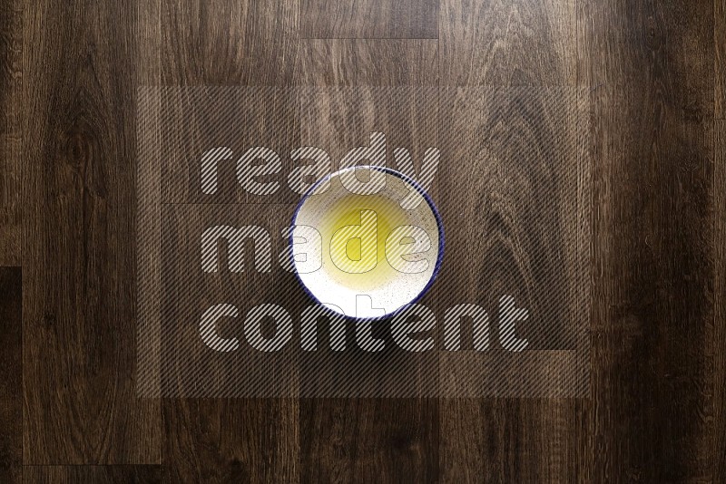 A bowl full of spices and salad dressing ingredients on wooden background