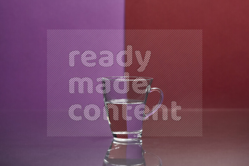 The image features a clear glassware filled with water, set against purple and dark red background