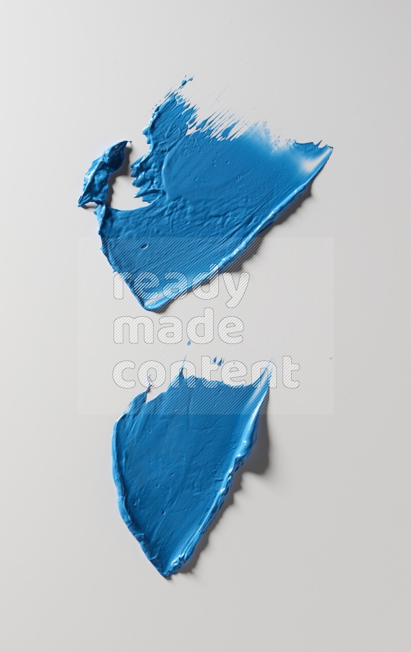 Blue painting knife strokes on white background